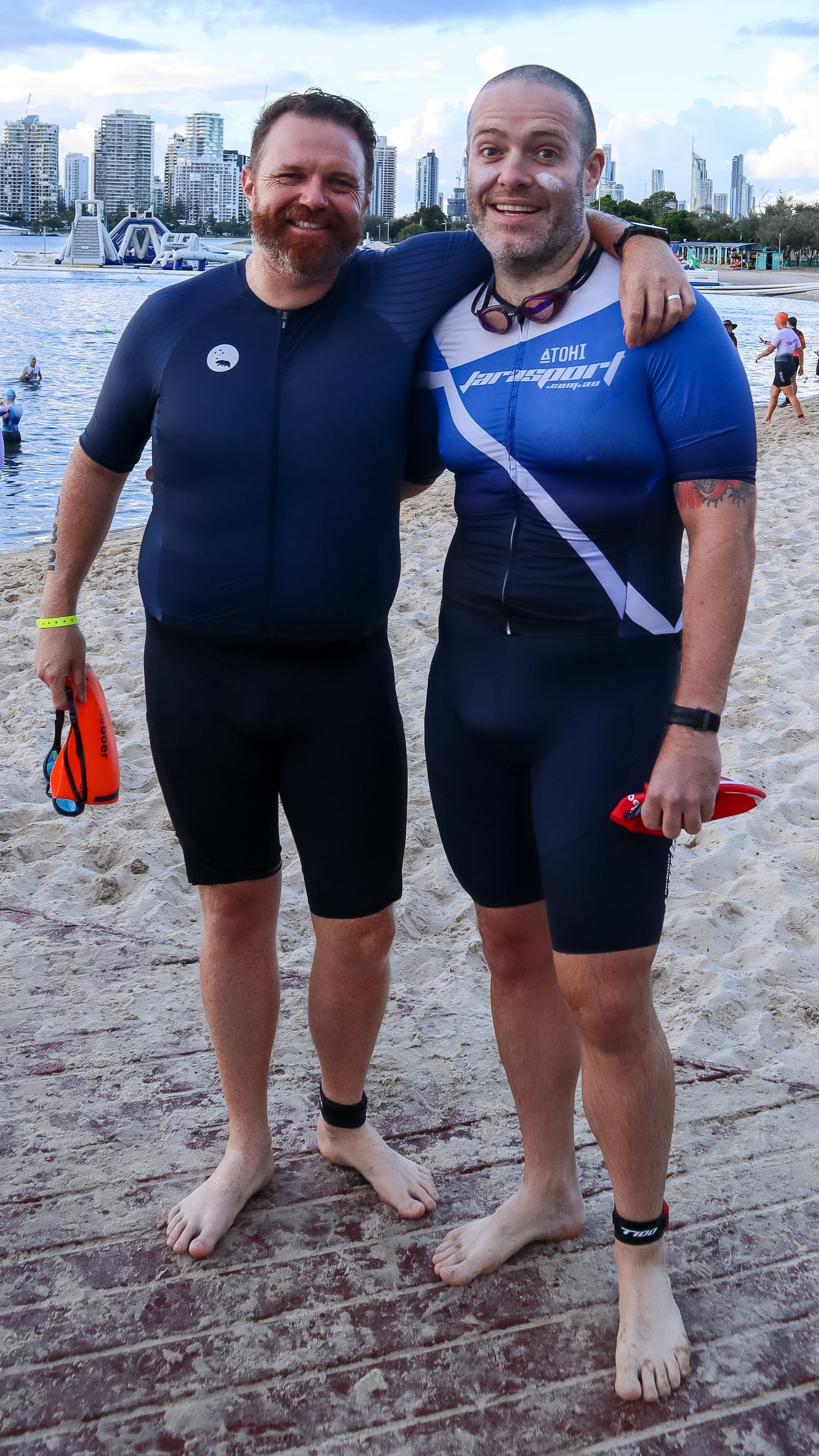 Two athletes at swim start with Gold Coast skyline